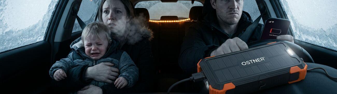 Family stranded in a car during a snowstorm charging a phone from the OSTNER power bank